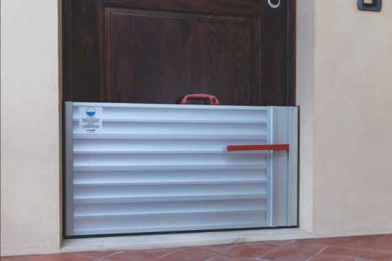 Modular flood barrier deployment at a commercial perimeter — deployment view 3